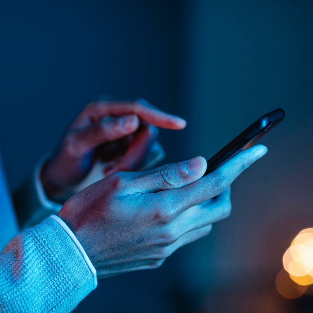 Side view of man using smartphone Side view of man using smartphone