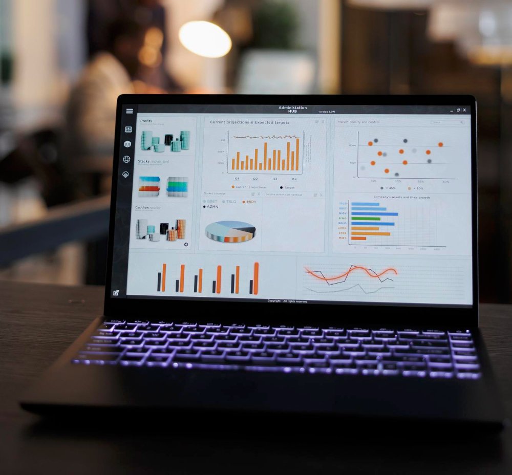 aptop computer with marketing statistics graphs on screen aptop computer with marketing statistics graphs on screen